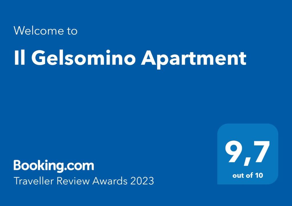 een blauw bord met de tekst welkom bij il gelomino afspraak bij Il Gelsomino Apartment in Pitigliano