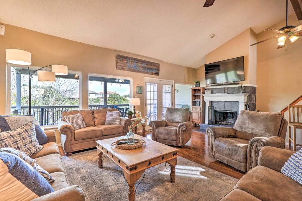 a living room filled with furniture and a fireplace at Lakefront Home with Point Venture Golf Access! in Point Venture