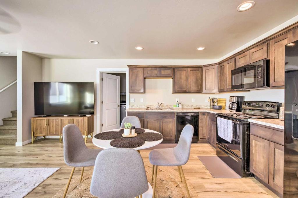a kitchen with a table and chairs in a kitchen at Belgrade Vacation Rental with Mountain Views! in Belgrade