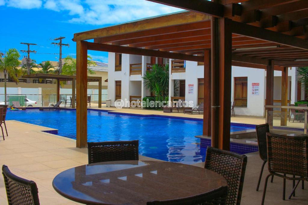 Bazén v ubytování Hotel Encantos de Itaperapuã nebo v jeho okolí