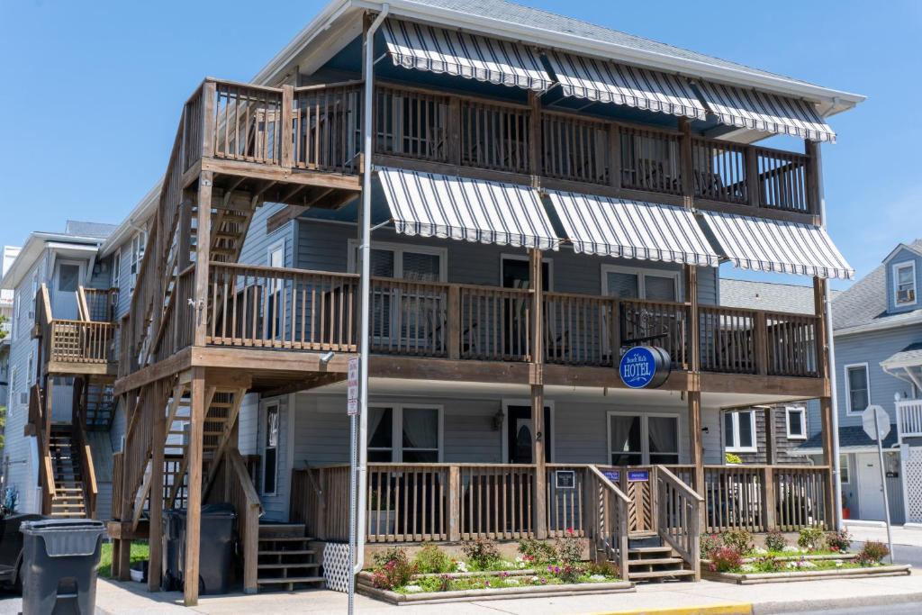 a apartment building with balconies on the side of it at Beach Walk Hotel in Ocean City