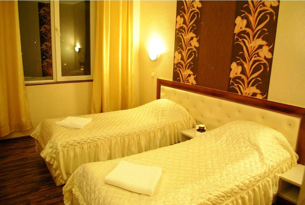 Postel nebo postele na pokoji v ubytování Rent Room hotel Dunav Center