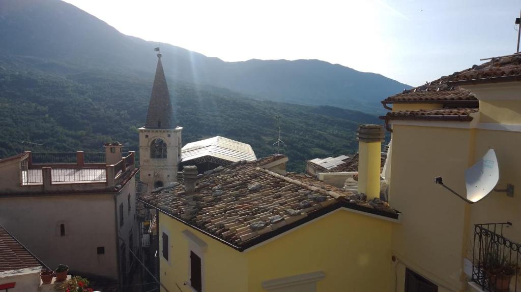 a view of roofs of buildings and a church at Majella National Park La Casa Di Nonna Maria in Caramanico Terme