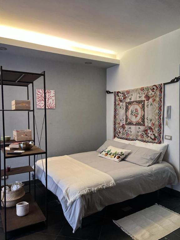 a bedroom with a bed with a pillow on it at Casa Roberto in Cefalù