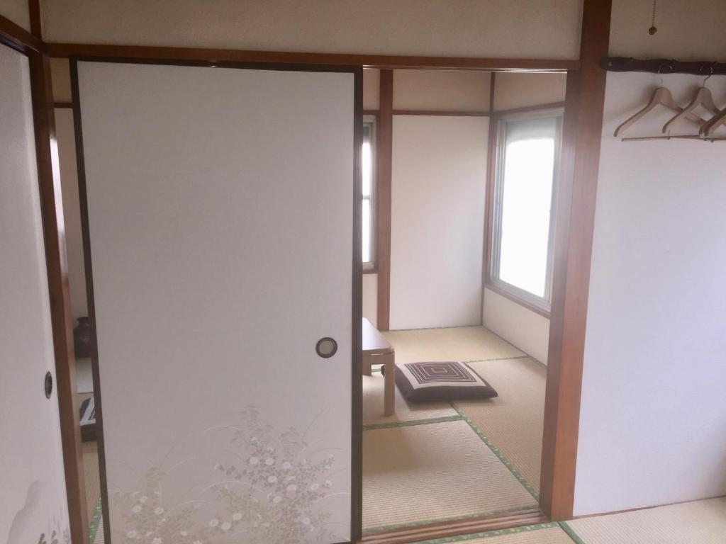 an open door in a room with a window at D-pdal Inn - Vacation STAY 39054v in Tokyo