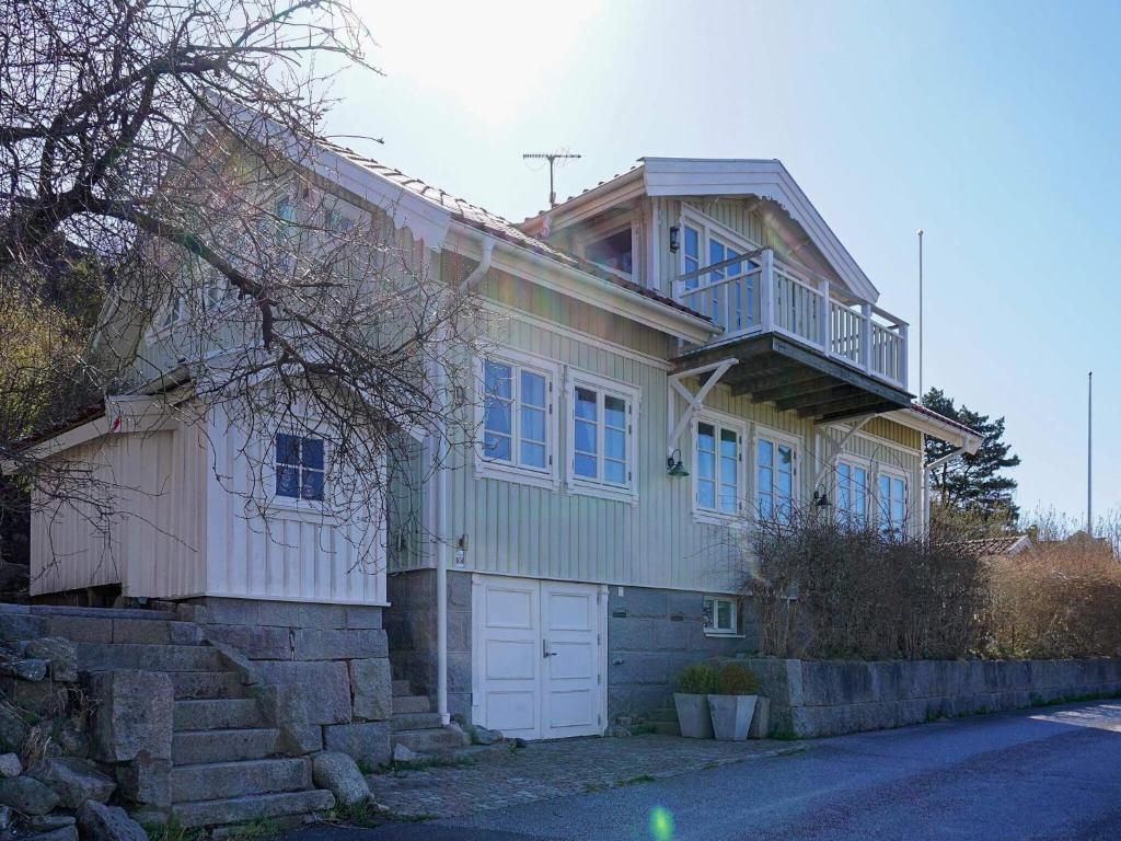a large house with a porch and a garage at 9 person holiday home in tånumshede-By Traum in Tanumshede