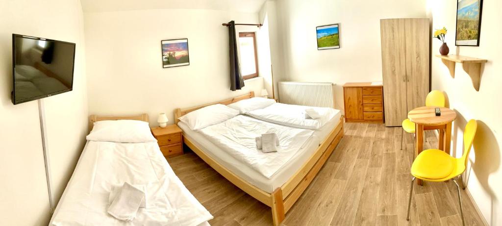 Postel nebo postele na pokoji v ubytování Penzion Dolní Morava