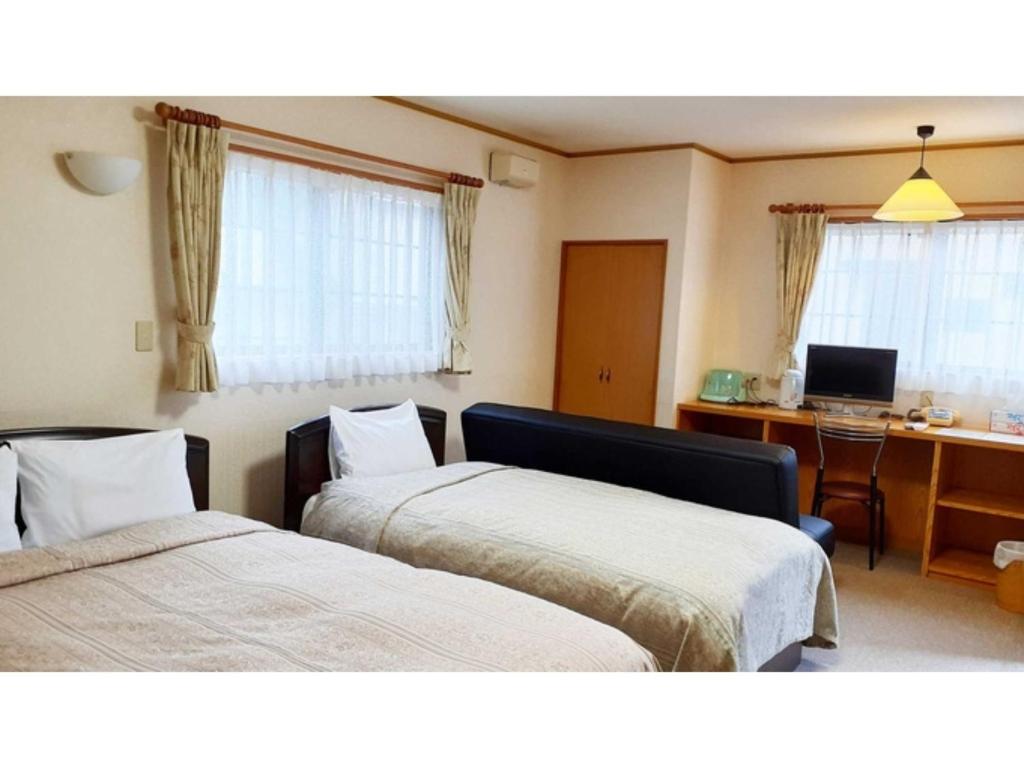 เตียงในห้องที่ Sudomari no Yado Sunmore - Vacation STAY 46742v