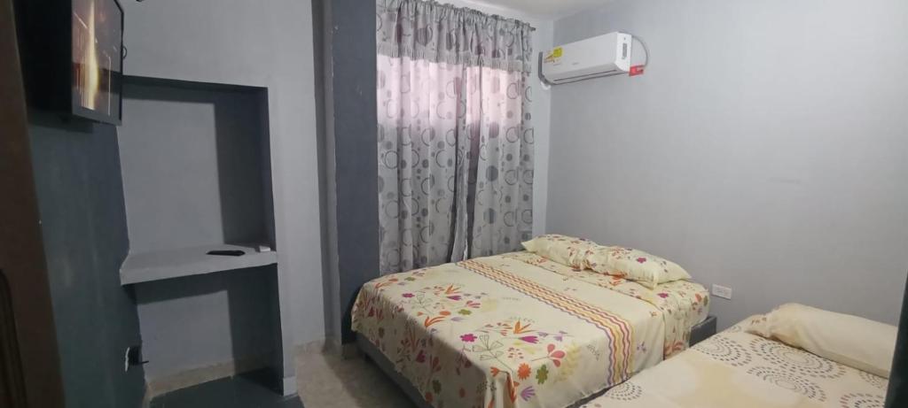 Postel nebo postele na pokoji v ubytování Apartamentos Puertas de Cartagena 203