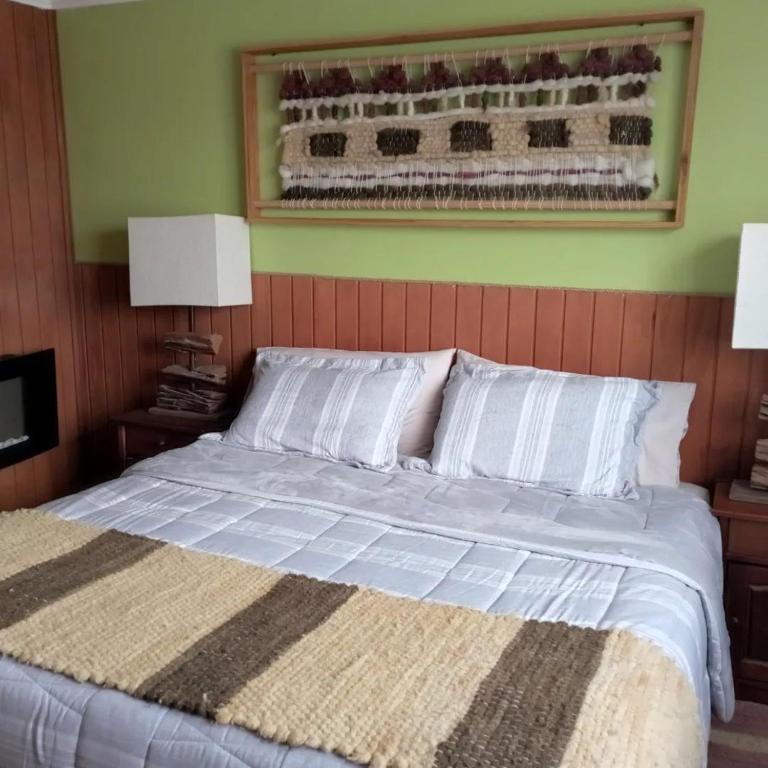 Postel nebo postele na pokoji v ubytování Hostal Mahuida