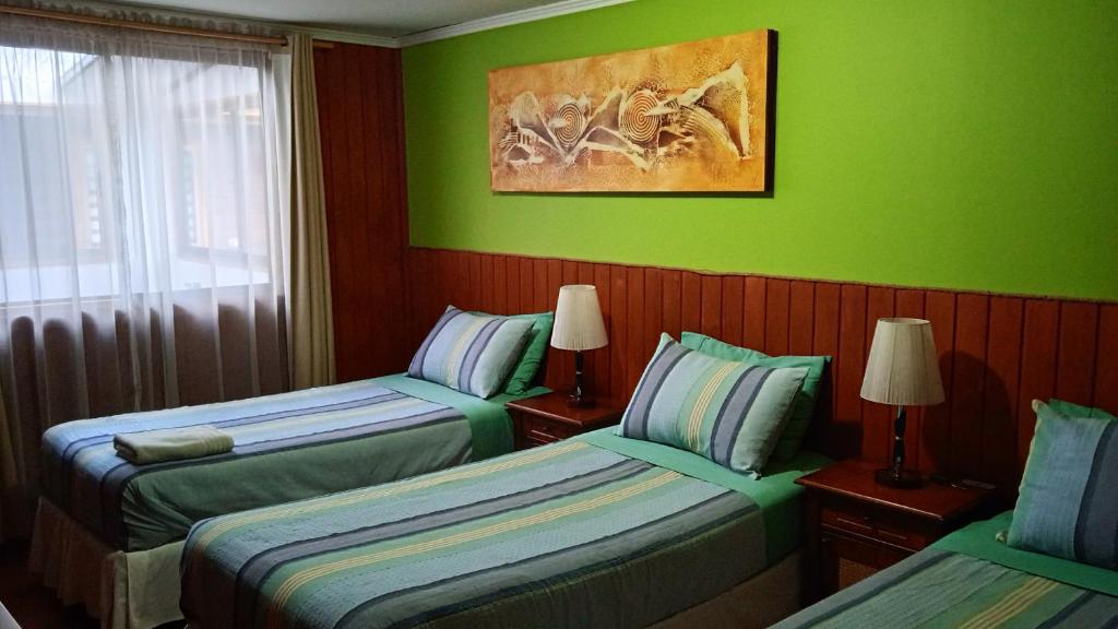Postel nebo postele na pokoji v ubytování Hostal Mahuida
