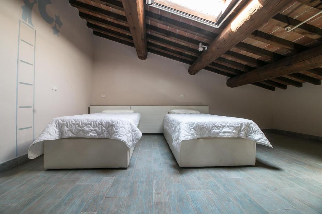 Postel nebo postele na pokoji v ubytování Fattoria Palazzeta - Pet & Family Friendly