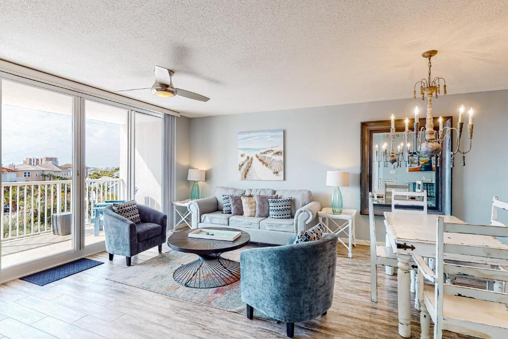 a living room with a couch and a table at The Terrace at Pelican Beach 304 in Destin