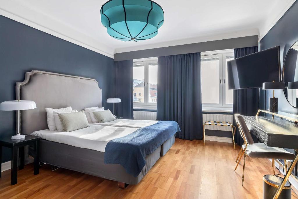 Postel nebo postele na pokoji v ubytování Centric Hotel