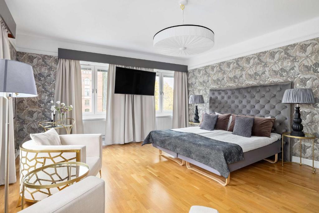 Postel nebo postele na pokoji v ubytování Centric Hotel