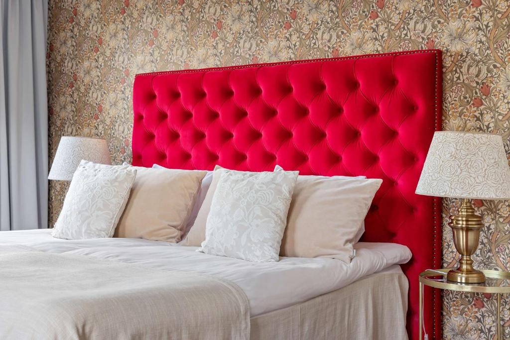 Postel nebo postele na pokoji v ubytování Centric Hotel