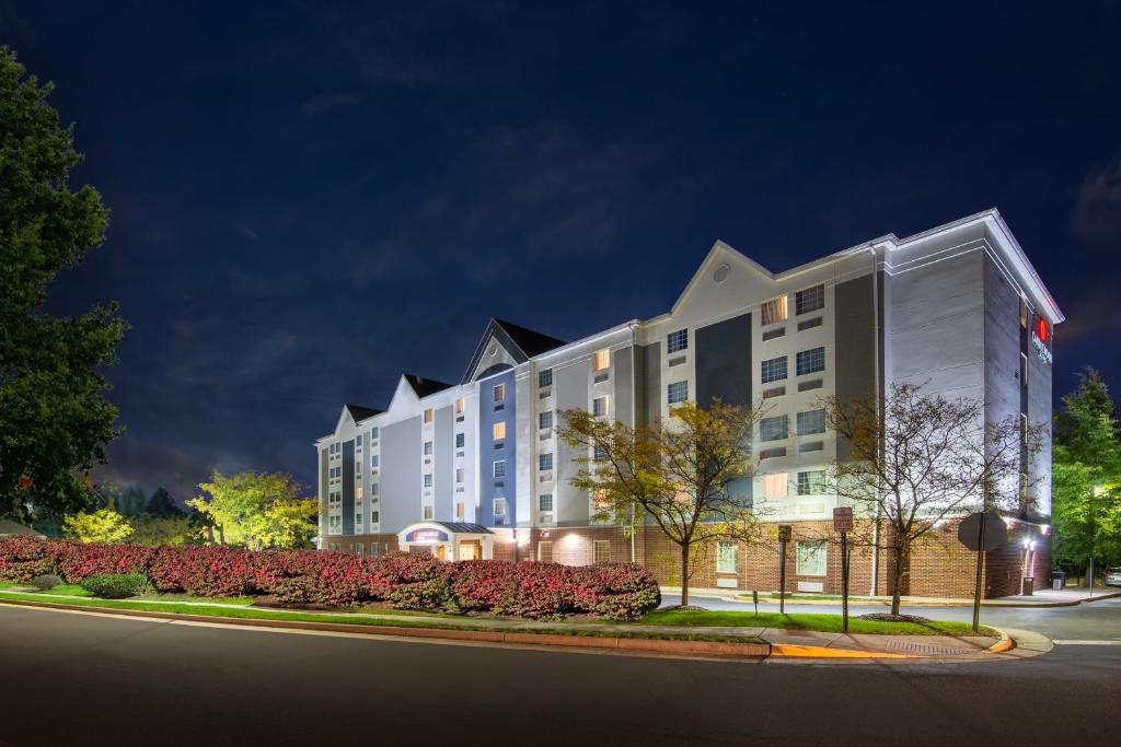 a rendering of a hotel at night at Candlewood Suites Manassas, an IHG Hotel in Manassas