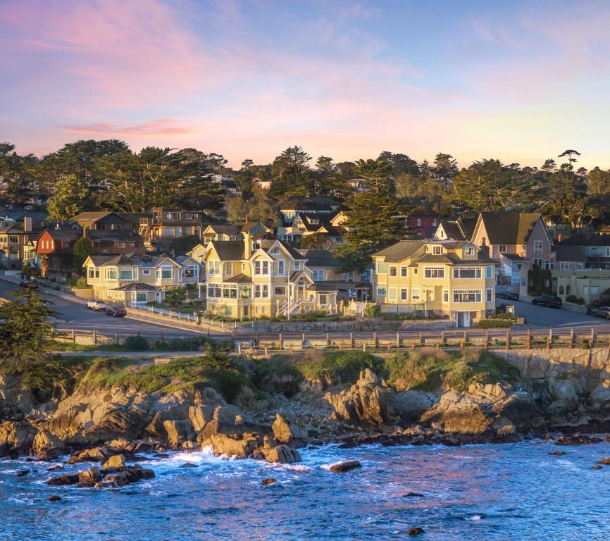a row of houses on the shore of the ocean at Seven Gables Inn on Monterey Bay, A Kirkwood Collection Hotel in Pacific Grove