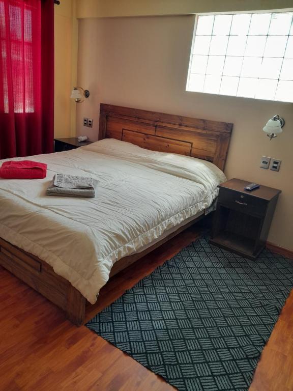 Postel nebo postele na pokoji v ubytování Hostal Nichkito