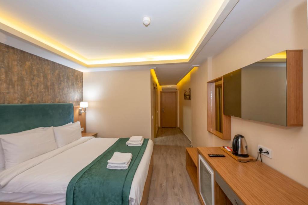 A bed or beds in a room at Hotel Devman