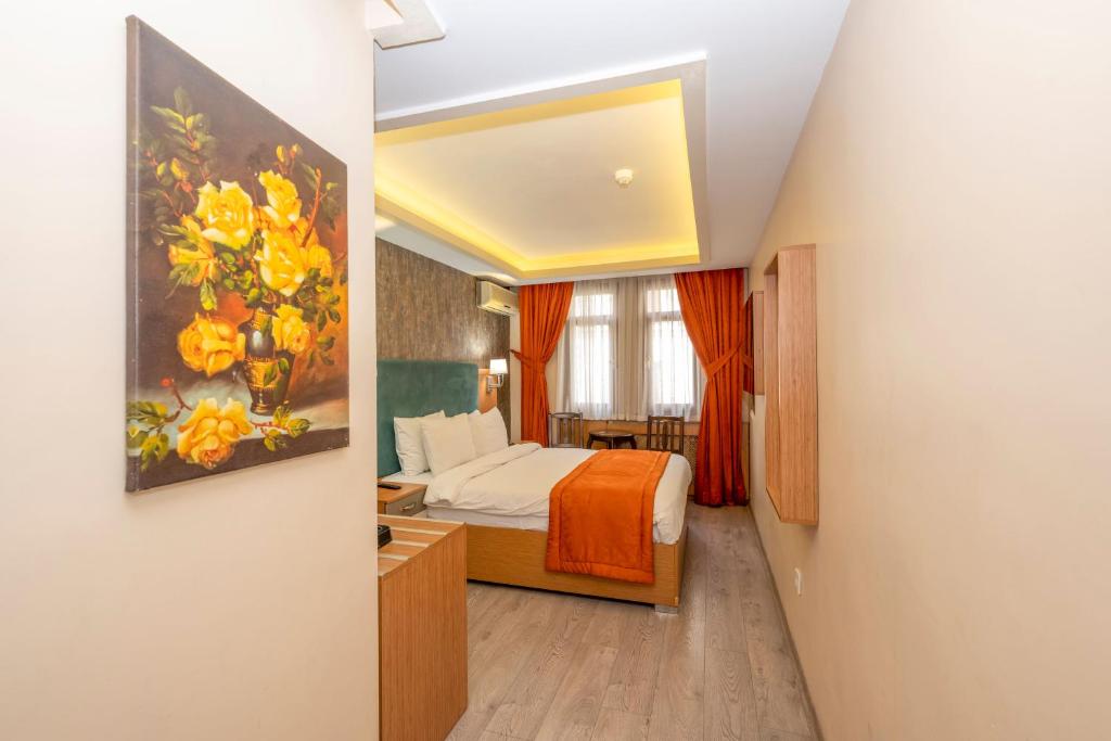 A bed or beds in a room at Hotel Devman