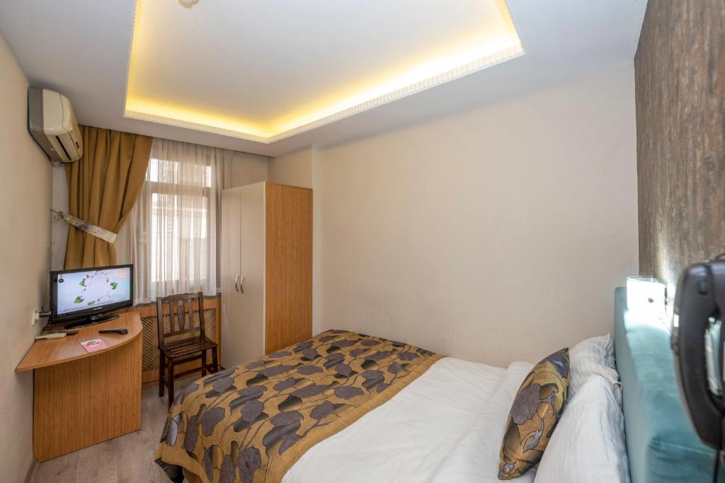 A bed or beds in a room at Hotel Devman