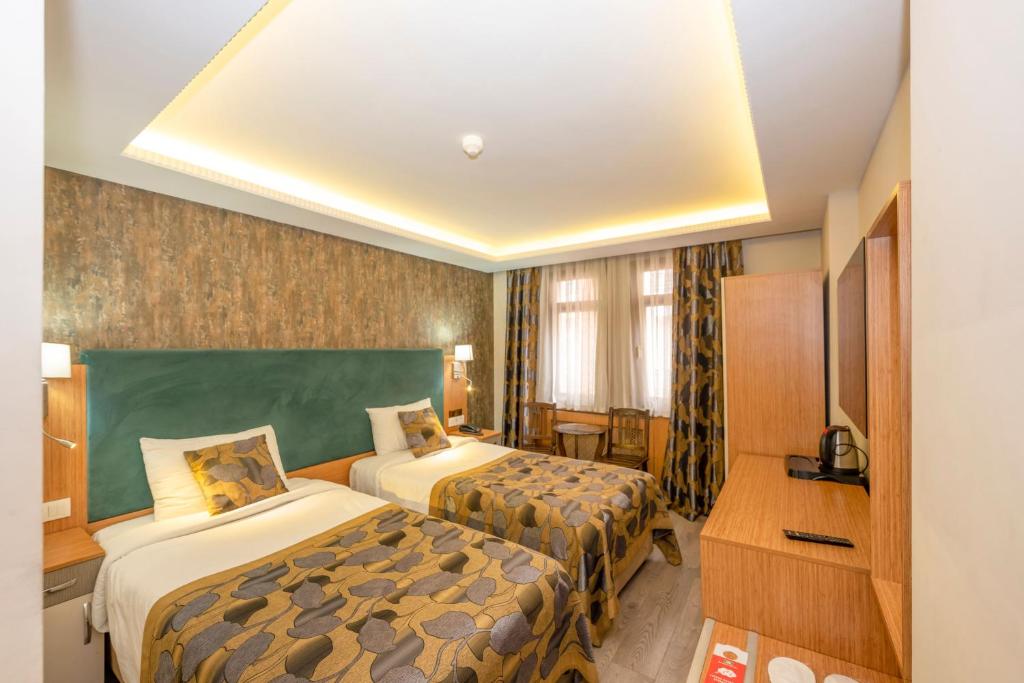 A bed or beds in a room at Hotel Devman