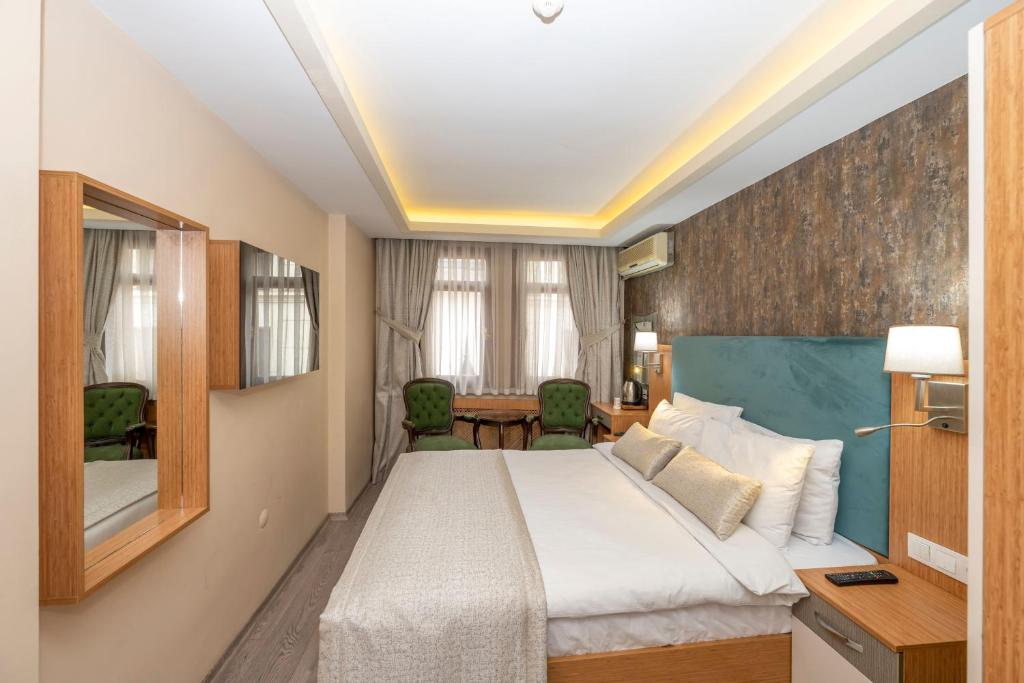A bed or beds in a room at Hotel Devman