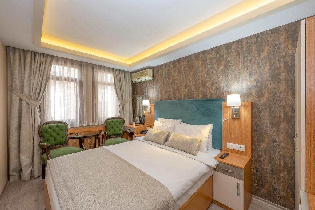 A bed or beds in a room at Hotel Devman
