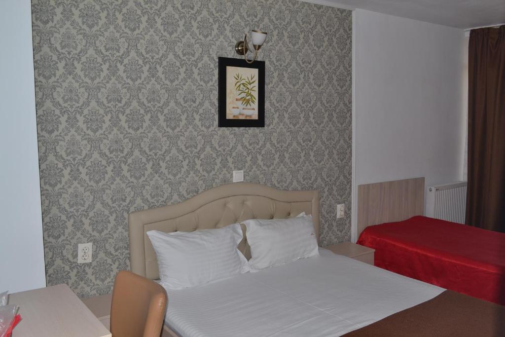 Postel nebo postele na pokoji v ubytování Live Tulcea Hotel