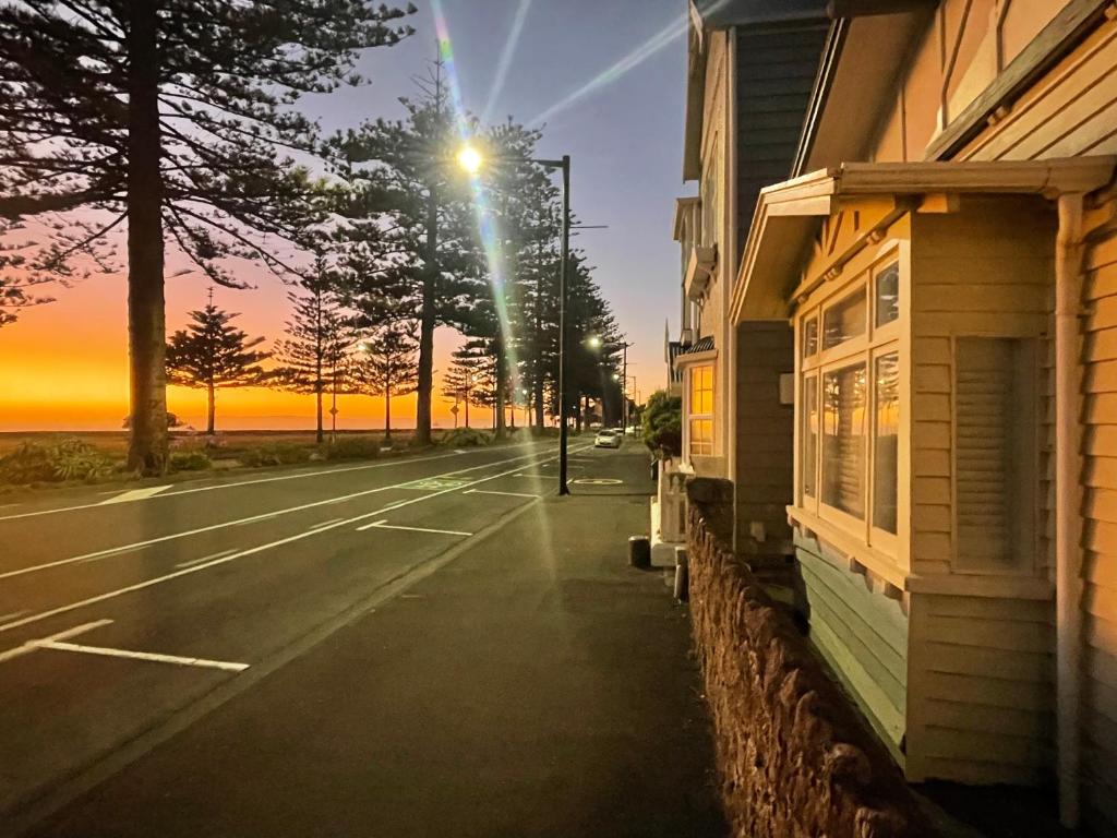 a street with a street light next to a building at Beach Front Studio Napier in Napier