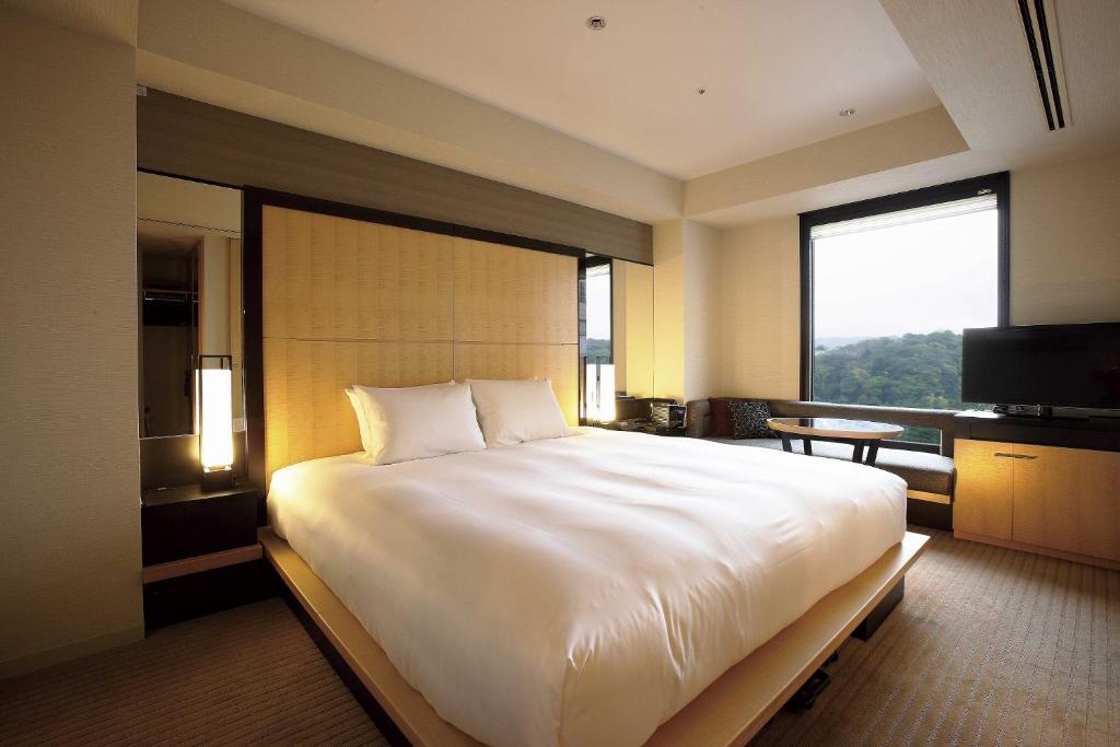 Postel nebo postele na pokoji v ubytování KOKO HOTEL Premier Kanazawa Korinbo