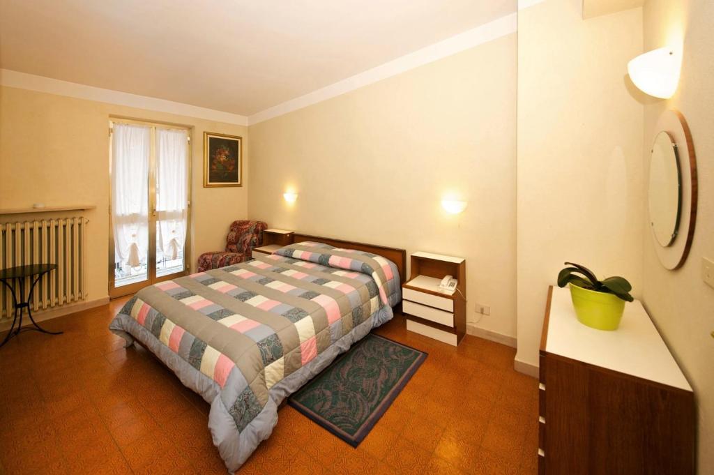 Postel nebo postele na pokoji v ubytování Albergo Ponte di Nava