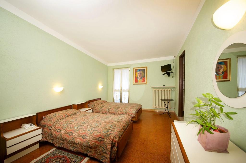 Postel nebo postele na pokoji v ubytování Albergo Ponte di Nava