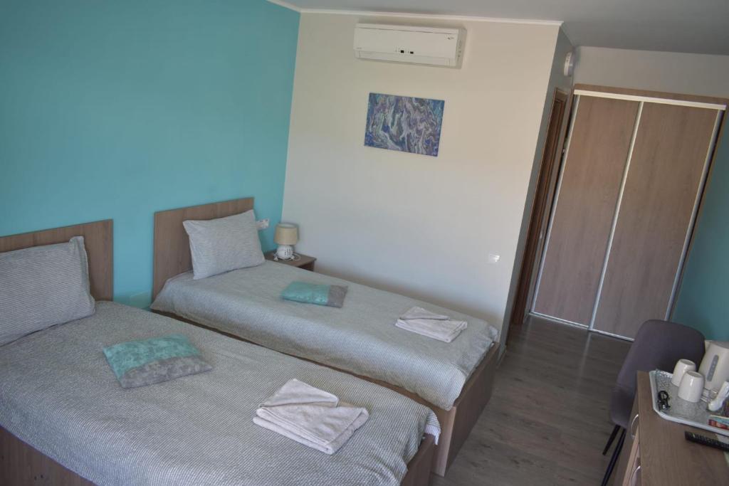 Postel nebo postele na pokoji v ubytování BBS Residence