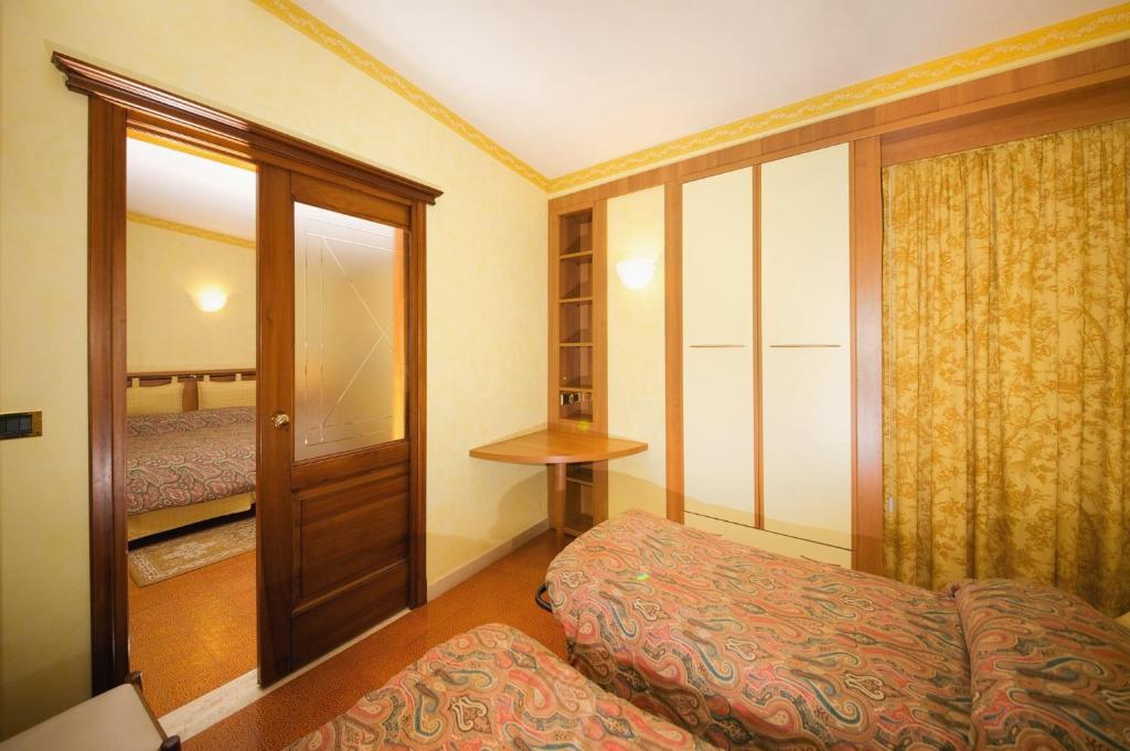 Postel nebo postele na pokoji v ubytování Albergo Ponte di Nava