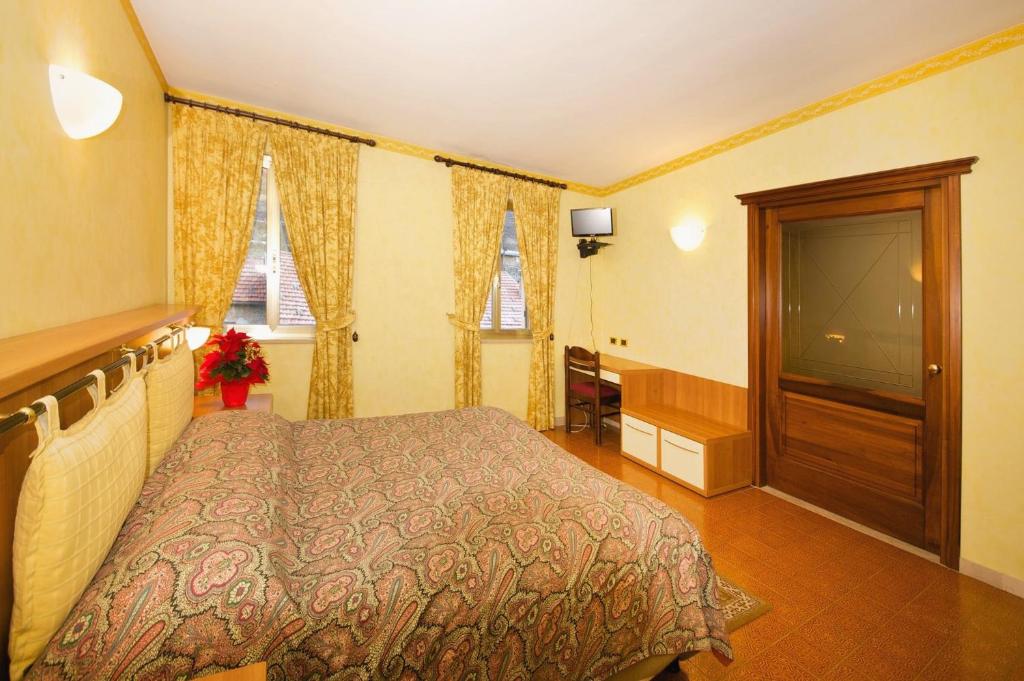 Postel nebo postele na pokoji v ubytování Albergo Ponte di Nava