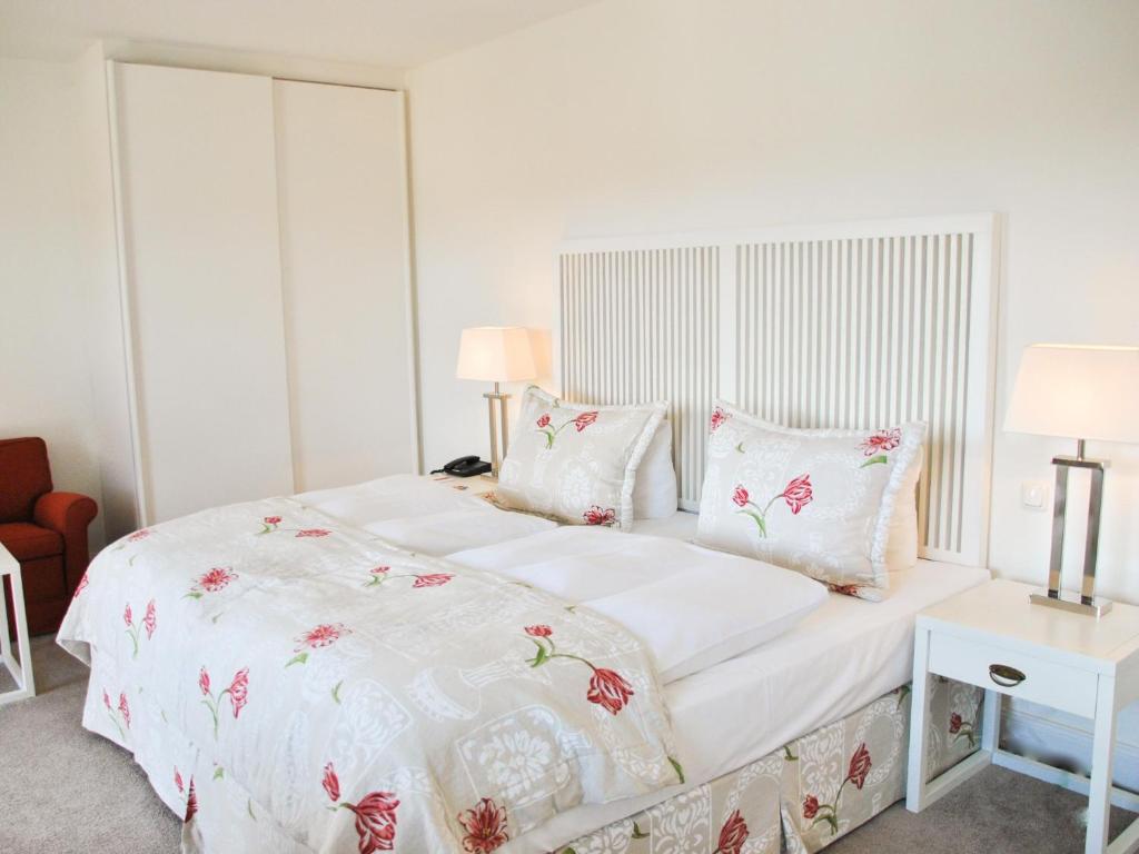 Postel nebo postele na pokoji v ubytování Strandhotel Miramar