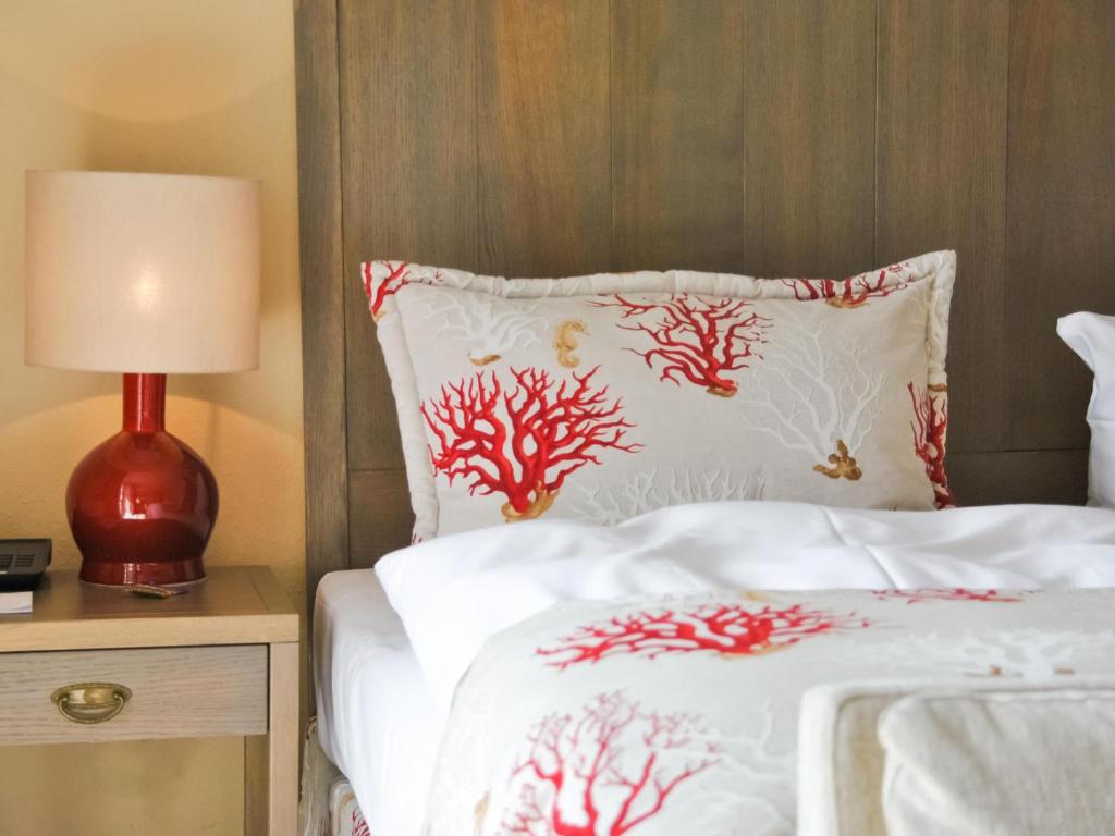 Postel nebo postele na pokoji v ubytování Strandhotel Miramar