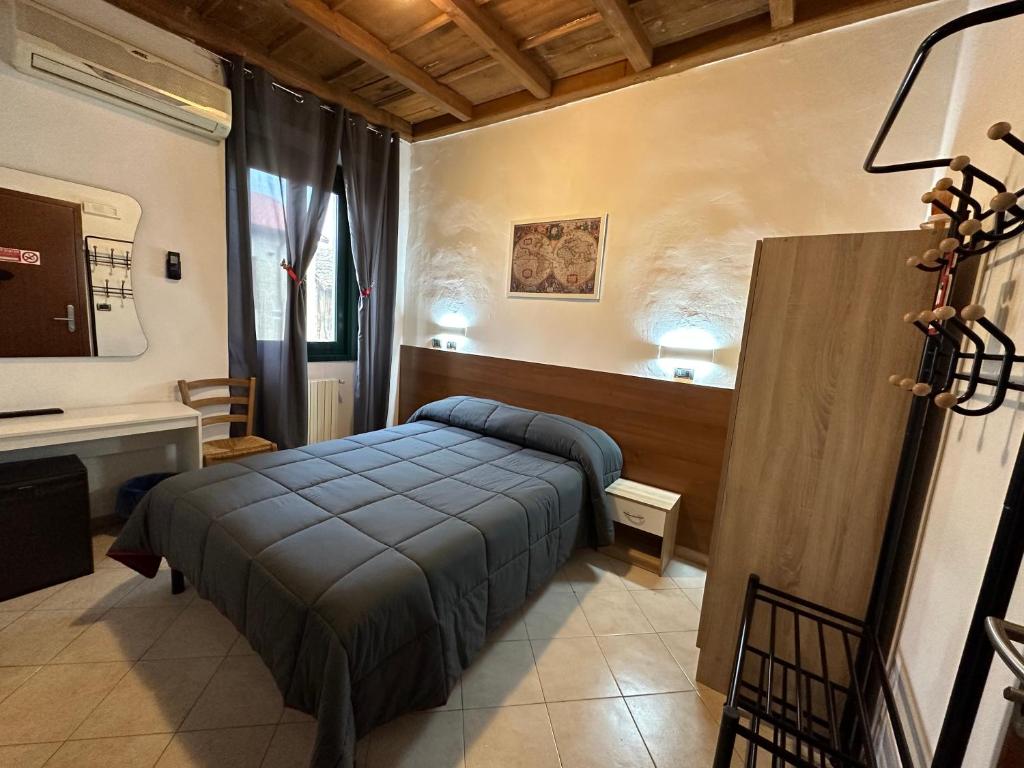 Ένα ή περισσότερα κρεβάτια σε δωμάτιο στο Hotel Duca di Tromello