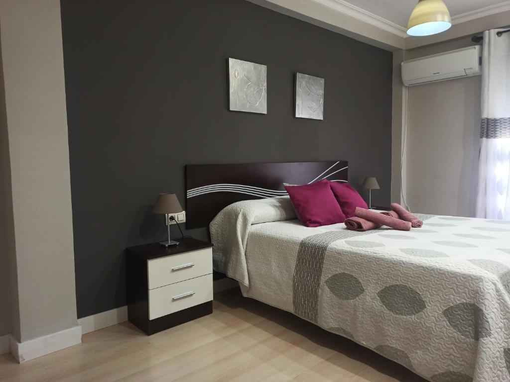 Posteľ alebo postele v izbe v ubytovaní Apartamento con parking privado gratis incluido