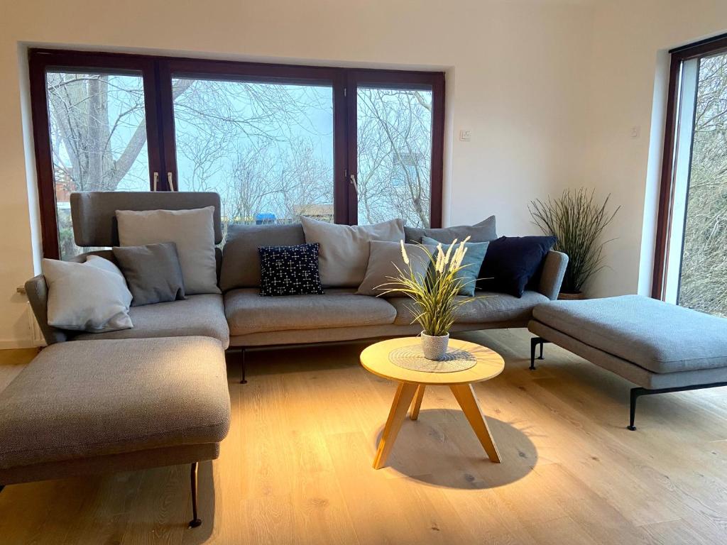 a living room with a couch and a table at Deichtraum - 1020 in Dahme
