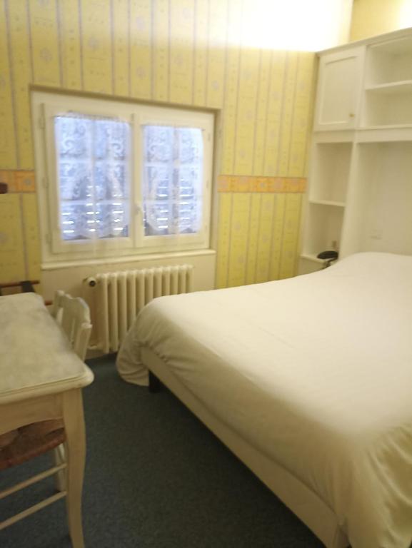 Postel nebo postele na pokoji v ubytování La Cremaillere