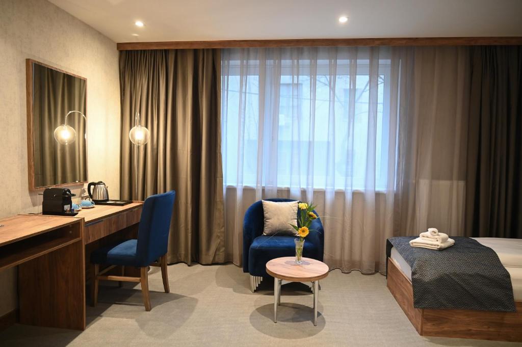 A bed or beds in a room at Hotel Foldana
