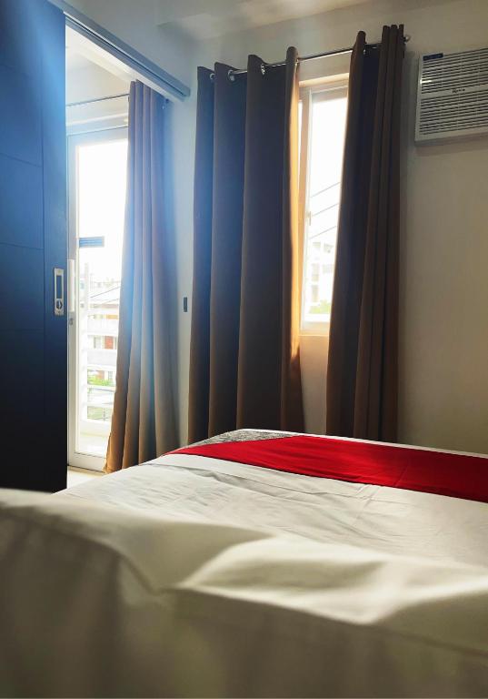 Postel nebo postele na pokoji v ubytování Airo Suites Makati