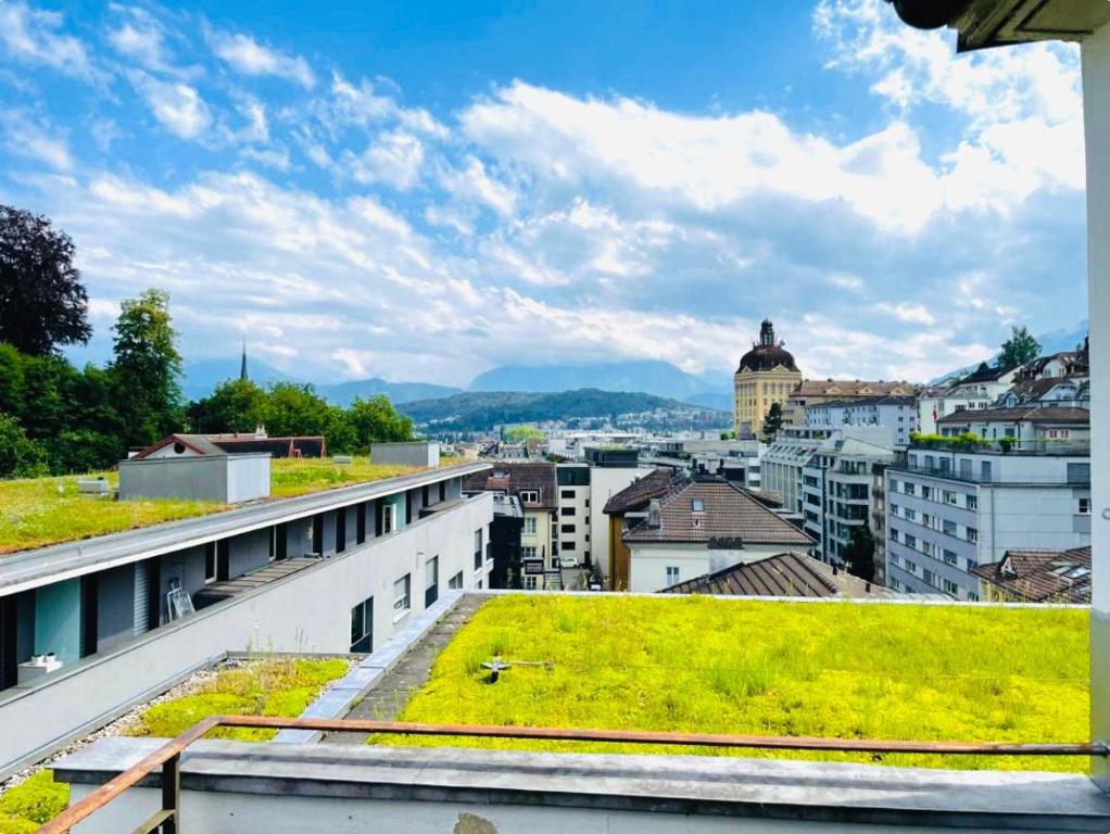 a view of a city from the roof of a building at Hawa Apartment - two balcony - by PA in Luzern