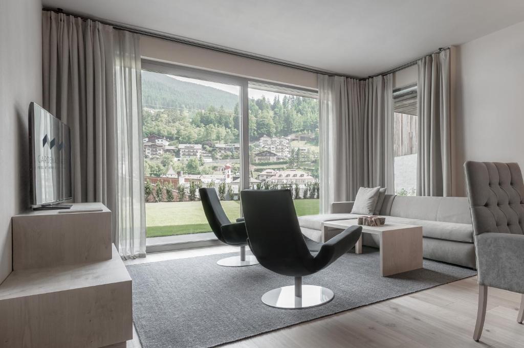 Posezení v ubytování Gardena Grödnerhof - Hotel & Spa