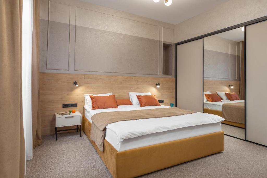 Postel nebo postele na pokoji v ubytování Jam Apartments Miskevycha
