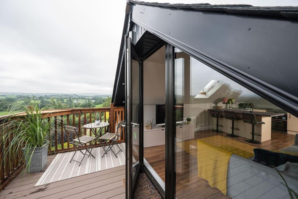 a house with a balcony with a view at Blairmont View Point in Armagh