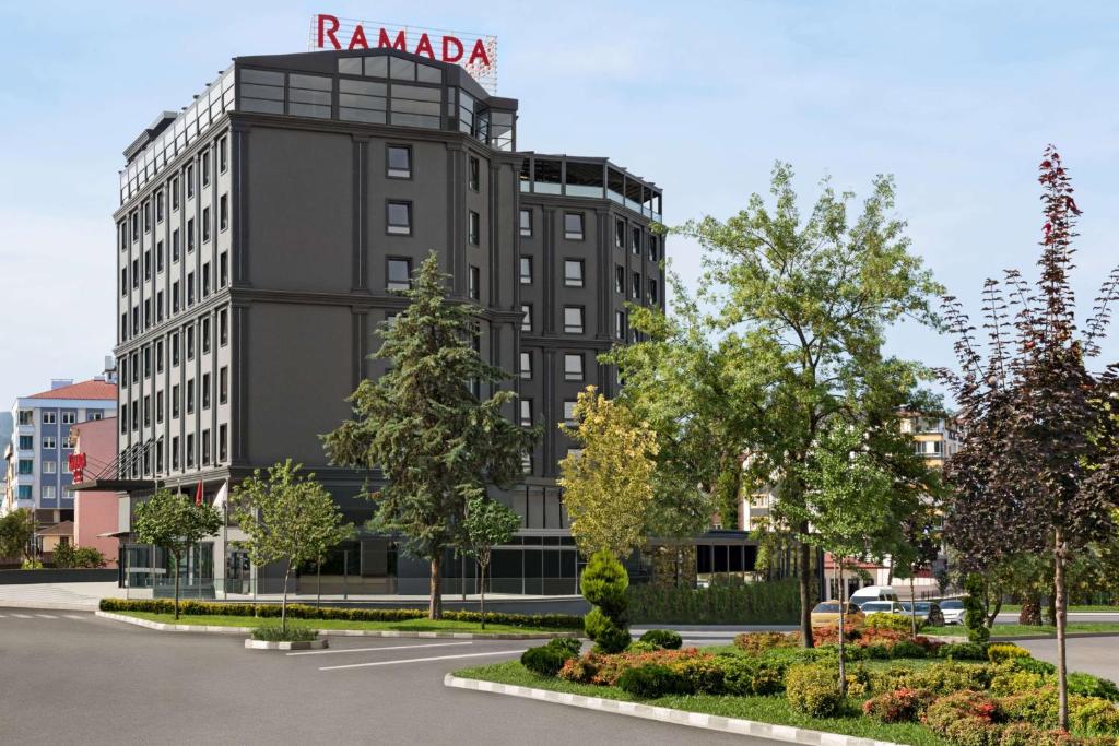 a building with a sign on top of it at Ramada Plaza by Wyndham Ordu in Ordu